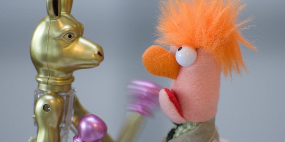 The Muppet Beaker boxes a golden metal kangaroo