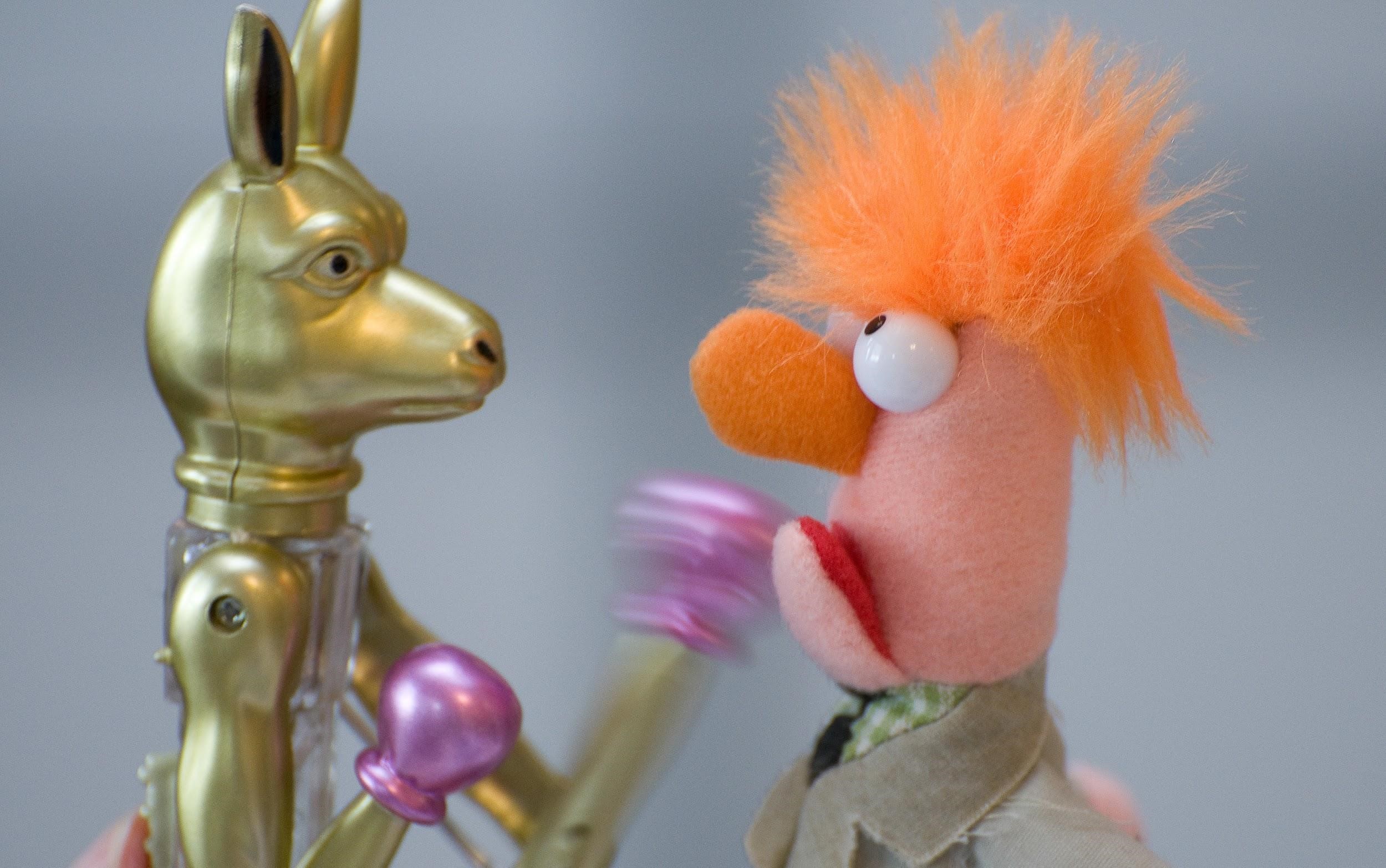 The Muppet Beaker boxes a golden metal kangaroo